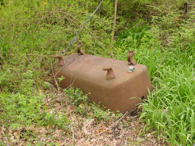 Upside down clawfoot tub in driveway