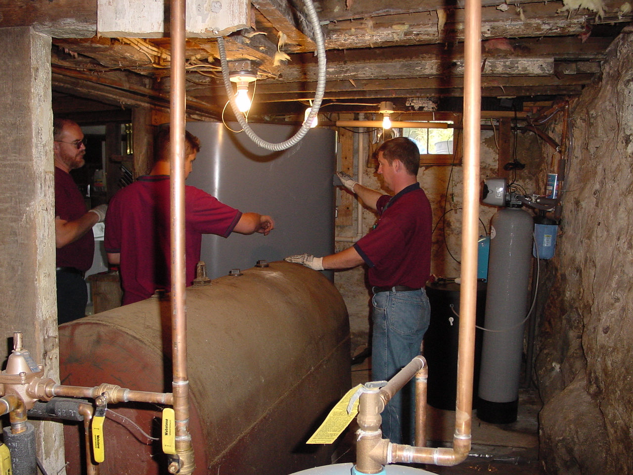 Bernie and Dan changing oil tanks