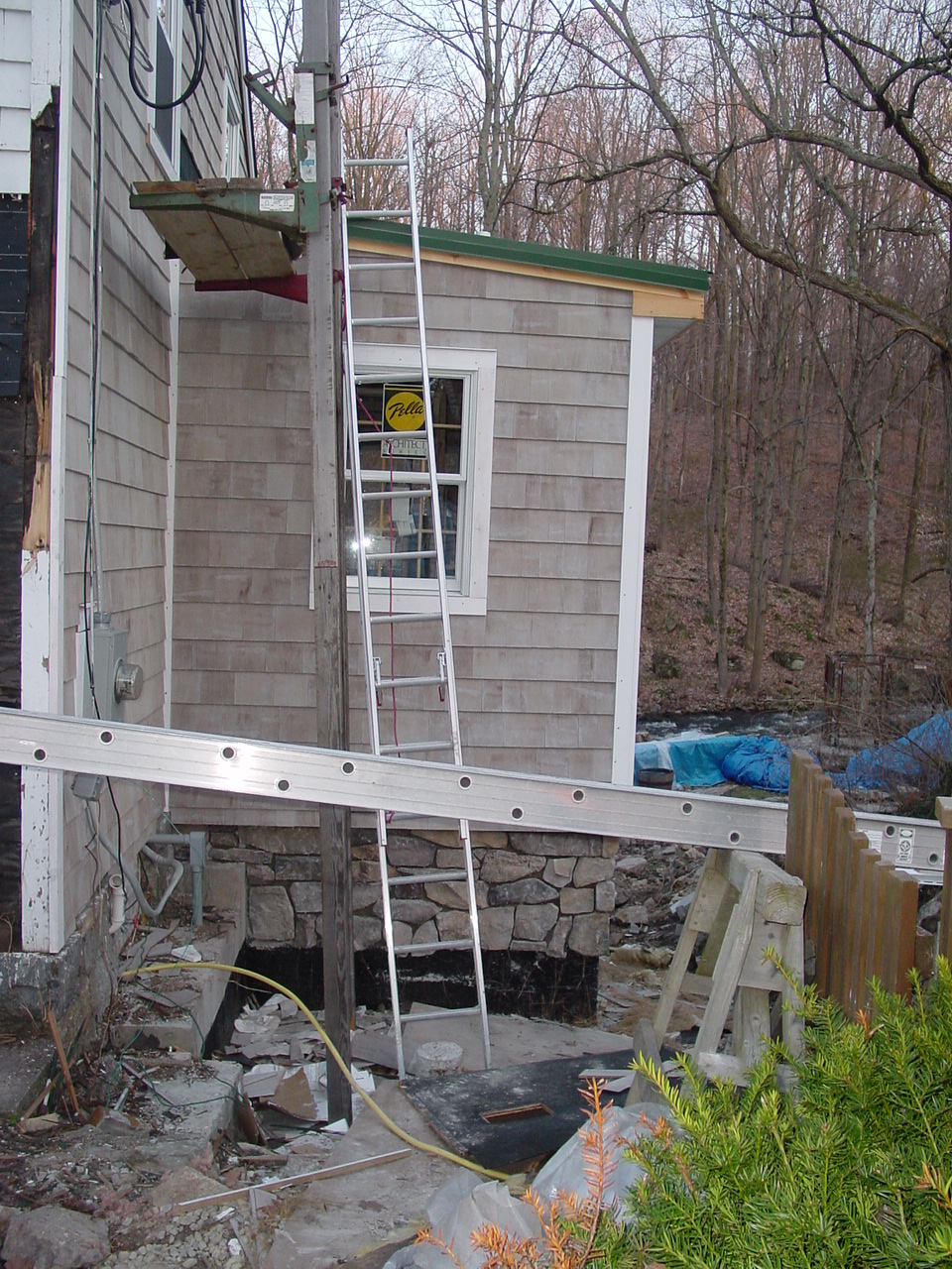 Stone veneer start around new foundation